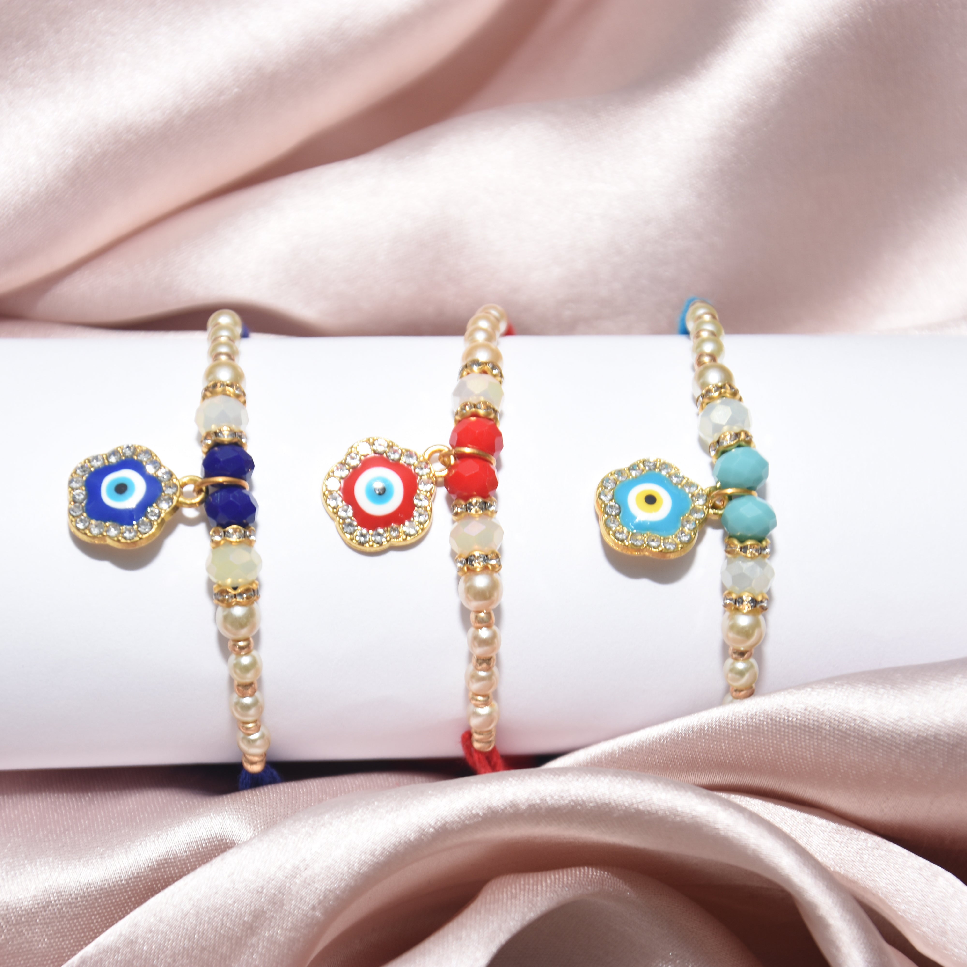 Flower and Pearl Designer - 3 Pairs Rakhi