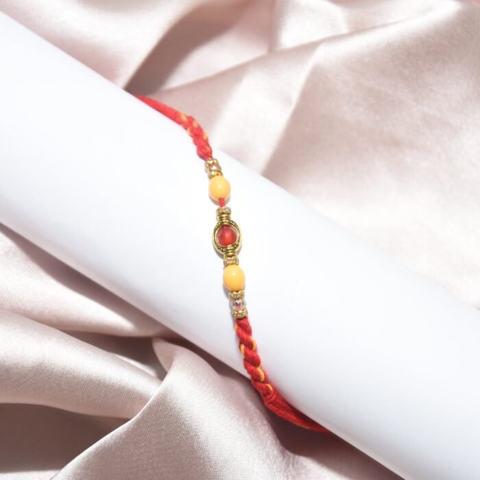 Pearl Designer - Red Stone Mauli Rakhi - Image 1