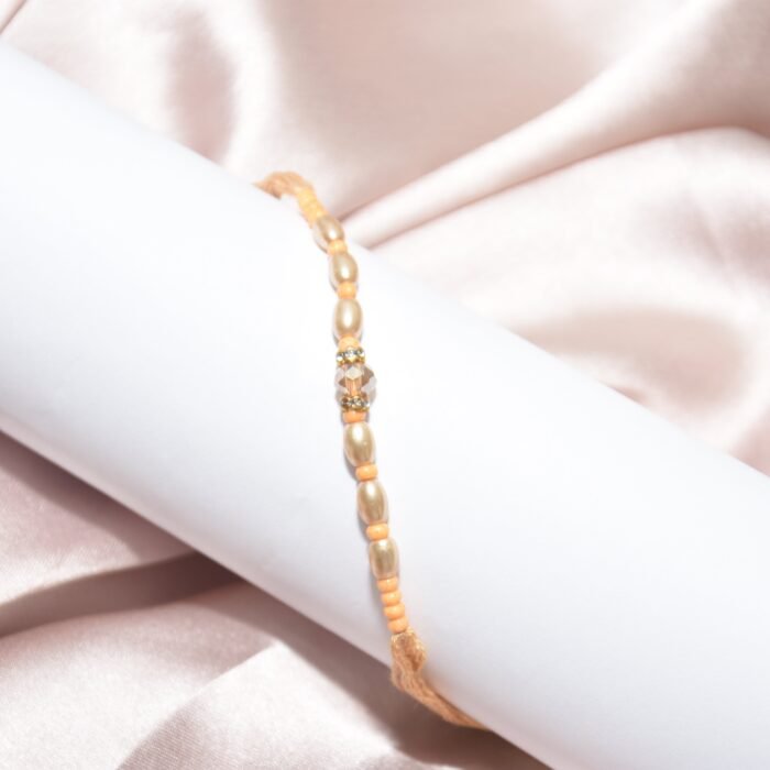 Pearl Designer - Golden Mauli Rakhi - Image 1